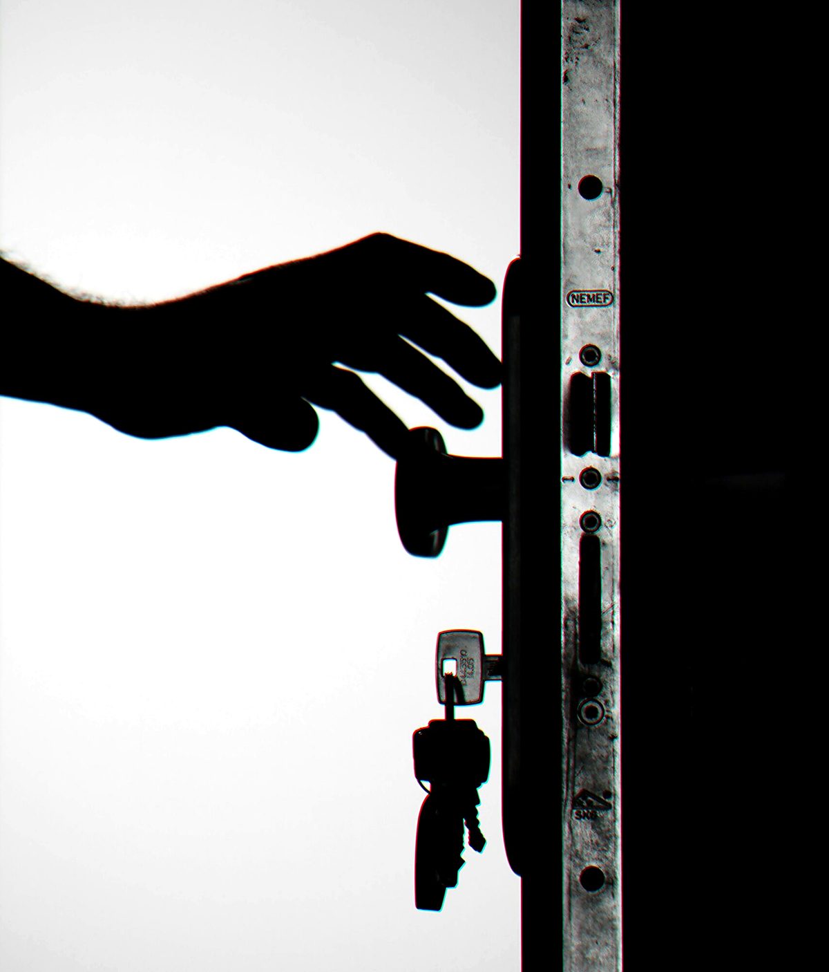 Hand opening a secured residential door