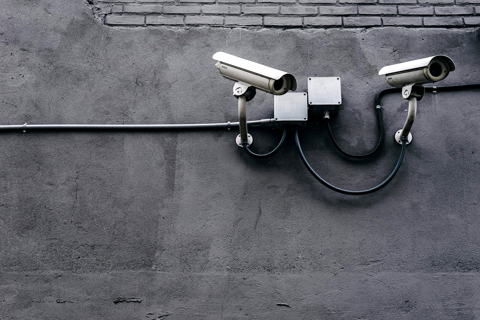 Surveillance cameras mounted on a wall